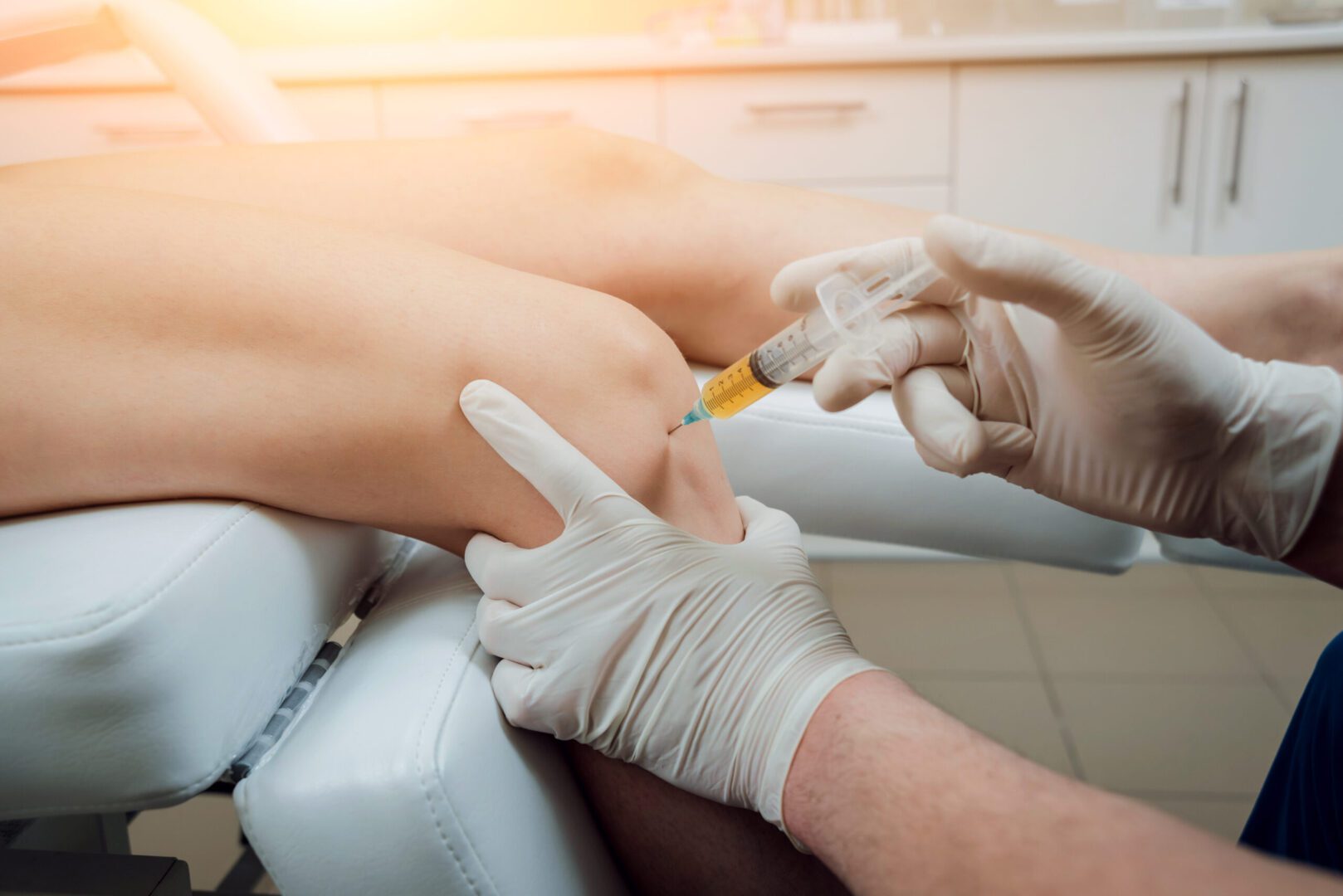 A person getting an injection in his leg.